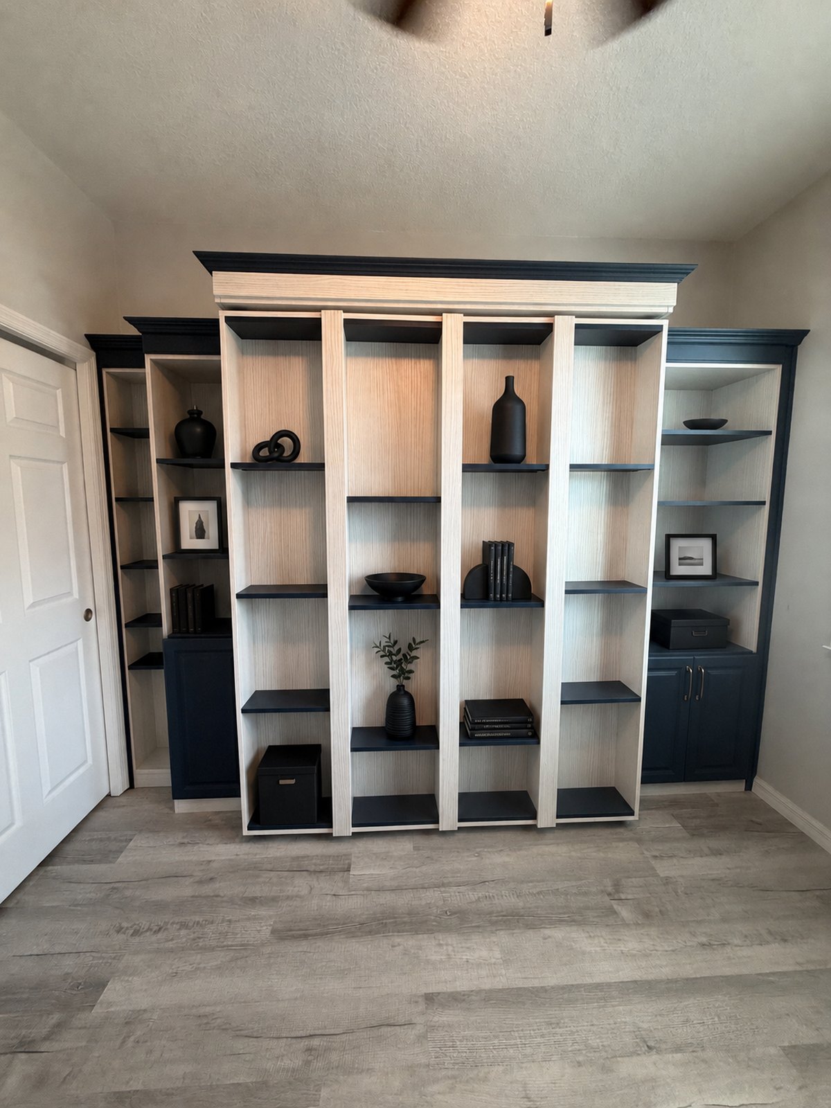Custom built-in with integrated wall bed and display shelving