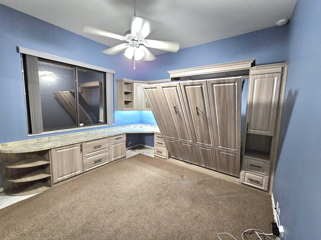 Custom wall bed closed, integrated into cabinetry