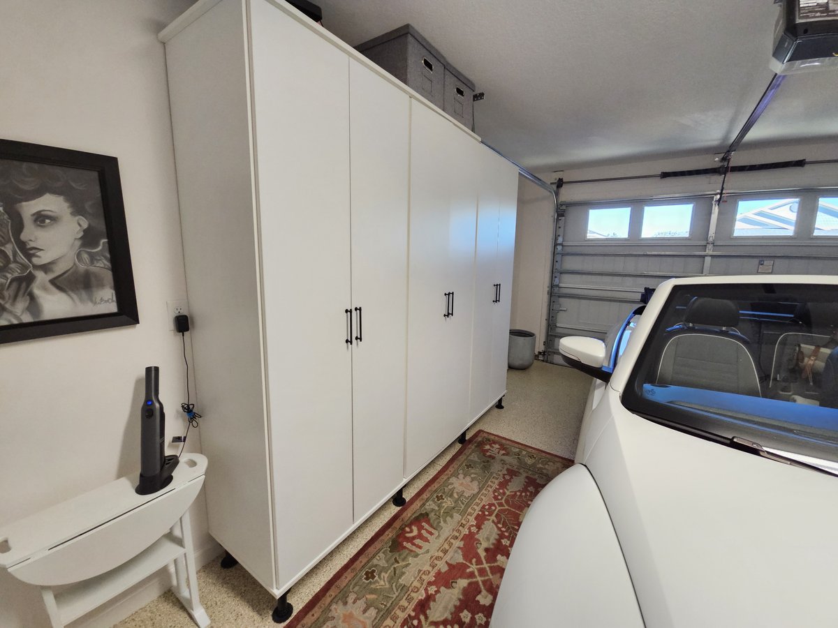 Garage cabinets with car and slat-wall storage